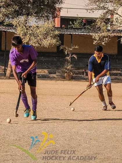 Two players work on their passing and receiving skills. Teamwork starts with mastering these fundamental interactions.