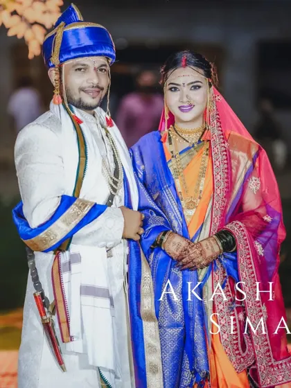 A classic wedding portrait of Akash and Sima in their stunning and colorful Maharashtrian wedding attire.