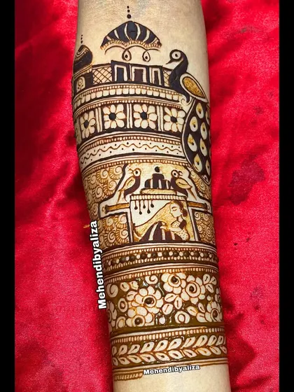 A close-up of the bridal arm startup, featuring a peacock and a palace, setting the stage for a royal theme.