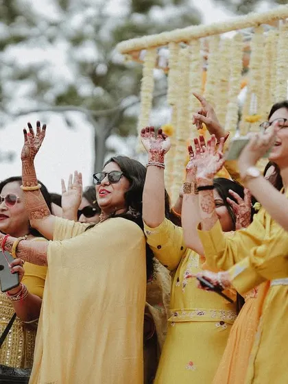 A duplicate of the bride's squad dancing, showing the importance of friends and family.