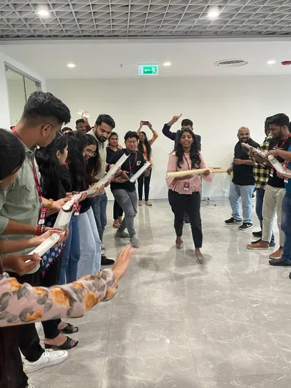 The teams are all smiles during this fun and engaging team-building activity.