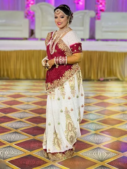 A full-length shot of the Gujarati bride, showcasing her complete traditional look from head to toe.