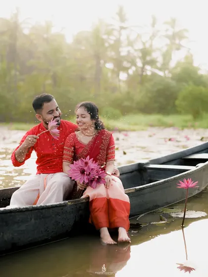 A sweet, playful moment with a single lotus flower. It's the small, spontaneous interactions that often make the best photos.