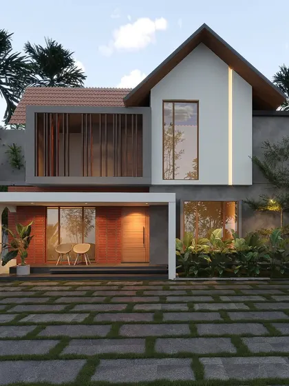 A play of volumes and materials, this home combines a white gabled structure with a concrete base and a warm brick-clad entryway.