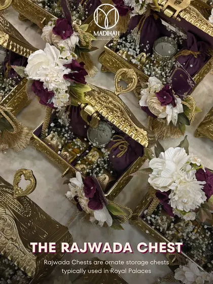 The Rajwada Chest, a name synonymous with royal palaces. This image showcases a collection of these ornate, gold-finished chests, ready to be filled with treasures for a grand wedding celebration.