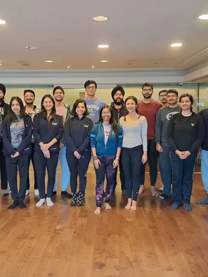 A group photo after a successful corporate yoga workshop. It's great to see companies investing in the health and well being of their teams.