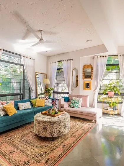 A sustainable home can also be vibrant and full of personality. This living room shows how we combine earthy materials like exposed brick with colorful, eclectic furniture and textiles to create a space that is both eco-friendly and deeply personal to its owners.