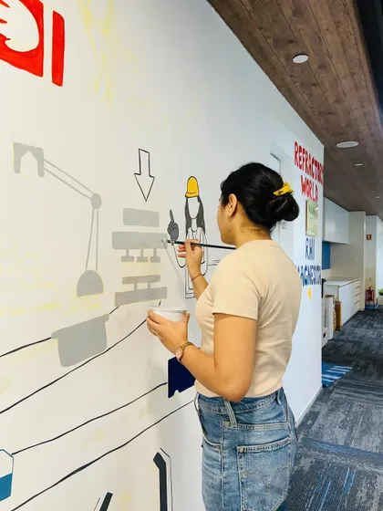 The process requires focus and a steady hand. This shot captures me working on the finer details and grey tones of the machinery illustrations for the RHI Magnesita project.