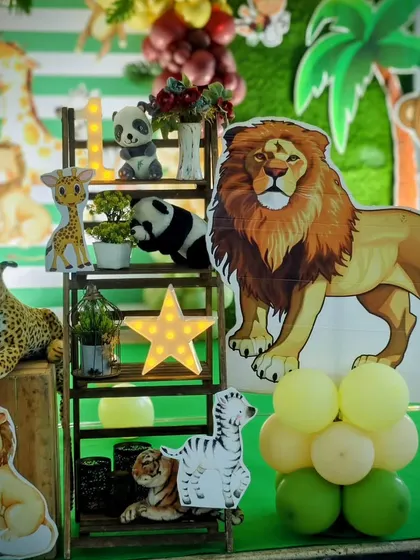 Details from Dhyaan's safari party, featuring a decorative ladder with plush animals and a light-up star. It's these little corners that guests love to discover.