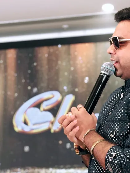 A close-up shot during a Sangeet performance. Every word I speak is meant to connect, to entertain, and to make the couple's special night even more memorable.