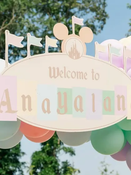 A close-up of the custom "Welcome to Anayaland" sign, featuring the iconic Disney castle silhouette.