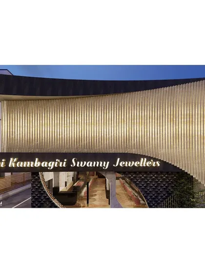 A focused view of the illuminated upper facade. This detail shot shows the precision of the design, where each vertical element contributes to a cohesive and impactful architectural statement for the retail brand.