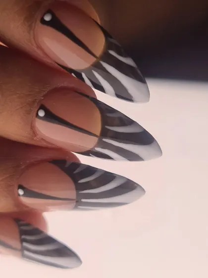 A detailed shot of the stiletto zebra print, emphasizing the precision of the hand-painted stripes.