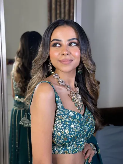 Another beautiful shot of the bride, showcasing her radiant smile and the flawless makeup.
