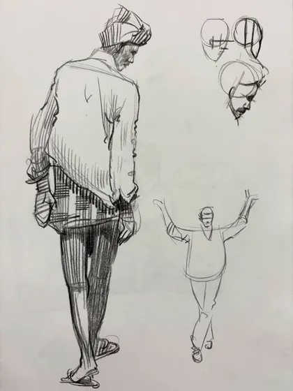 A figure sketch from the back, with smaller studies of head construction.