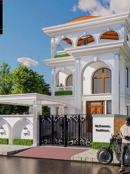 Mr. Praveen's residence is a neoclassical masterpiece, boasting majestic arches, intricate moldings, and grand columns. The pristine white facade is complemented by warm wooden accents and terracotta roof tiles, creating a perfect harmony of tradition and modernity.