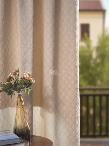 A subtle, diamond-patterned curtain fabric that creates a serene backdrop in a client's home. We love helping you create a home that reflects your personality, comfort, and style.