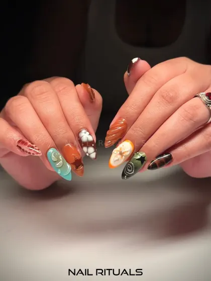 A full view of this bold and personal set. The combination of different colors, textures, and 3D elements creates a manicure that is truly one of a kind.