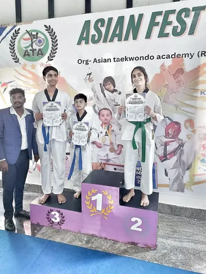 Our students on the podium at the Asian Fest Taekwondo Championship, a proud moment for the team.