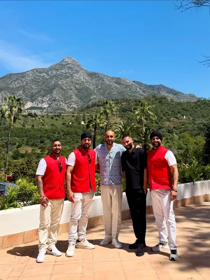 The whole crew posing against the mountain backdrop in Marbella. What a team, what a location.