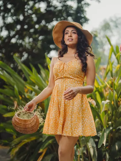 A candid, in-motion shot that feels natural and unposed. It effectively shows how the dress moves and looks in a real-world environment.