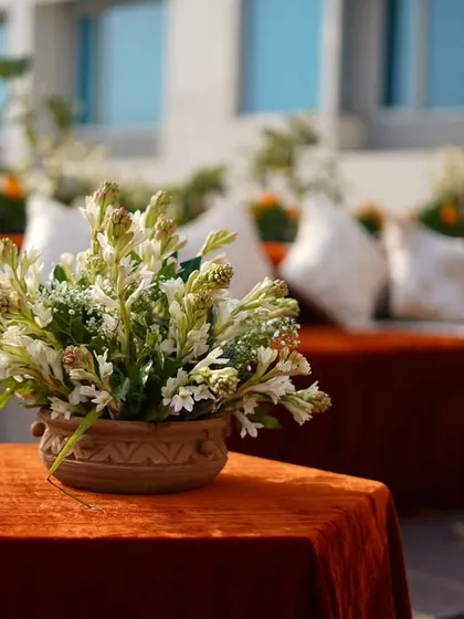 Another angle of the beautiful centerpiece, with the cozy lounge seating in the background, showcasing the balance of comfort and style.