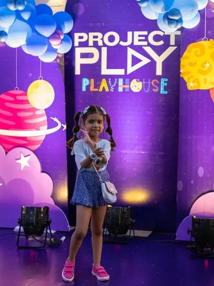 Posing in front of the awesome Project Play backdrop. It's a space-themed wonderland for digital adventures.