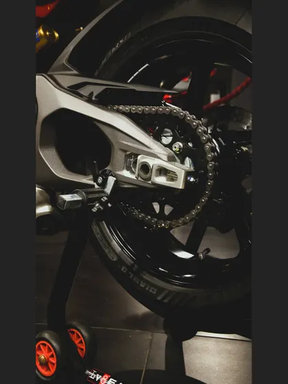 The single-sided swingarm of the Ducati Panigale V4, a signature of Italian design and engineering.