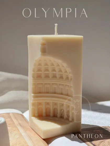 A beautifully lit shot of the Pantheon candle. The sunlight catches the architectural details, showing the depth and craftsmanship of the piece.