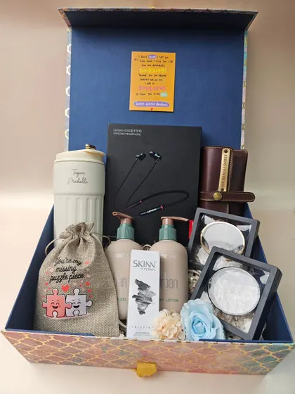 This hamper is a perfect gift for your Bhaiya and Bhabhi. It includes a mix of practical and pampering items like a travel mug, earphones, lotions, and other thoughtful goodies, all customizable to your budget.