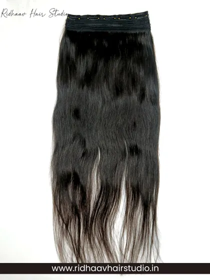 This is our full 5-clip ear-to-ear straight extension piece. It's a single, wide weft that adds significant length and volume across the back of your head in one easy step.
