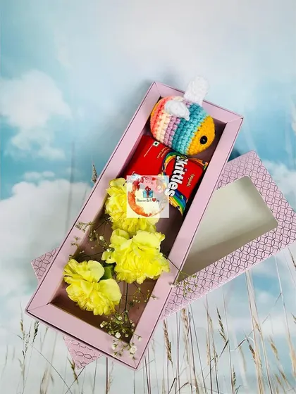 Another version of our cute hamper, this one featuring a colorful crocheted bee alongside yellow carnations and Skittles.