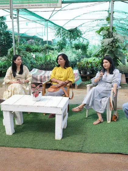 An interactive panel discussion happening right inside my greenhouse. The natural light and surrounding plants create a uniquely engaging setting for sharing knowledge and ideas.