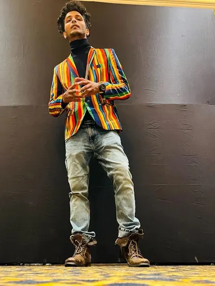 A full-body shot showing off a more formal, eclectic style for an event. Fashion and dance are both forms of self-expression for me.