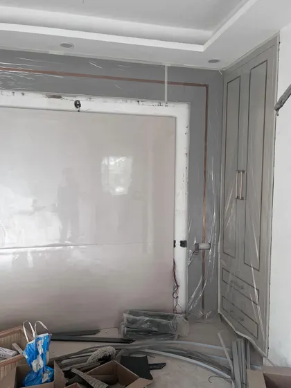 A glimpse of the raw, unfiltered reality of an interior design project. This photo from a site in Saket shows the space during the construction phase, with materials and tools ready for the transformation.