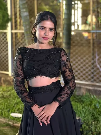A beautiful portrait of Meghana in the custom black ensemble.