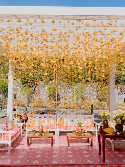 Another angle of the stunning lounge with hanging yellow tassels, creating a curtain of sunshine.
