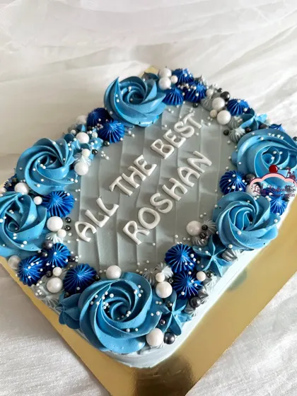 Fifty shades of blue. A beautiful sheet cake with intricate blue rosette and star piping, perfect for an office farewell party.
