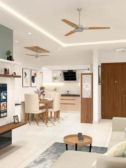 An open-concept living area where the living room, dining space, and kitchen flow into one another. We used a consistent color scheme of white, wood, and a soft green accent to unify the large, airy space.