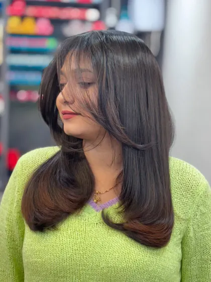 The way the layers fall in this haircut is just perfect. It's a versatile style that looks great on everyone.