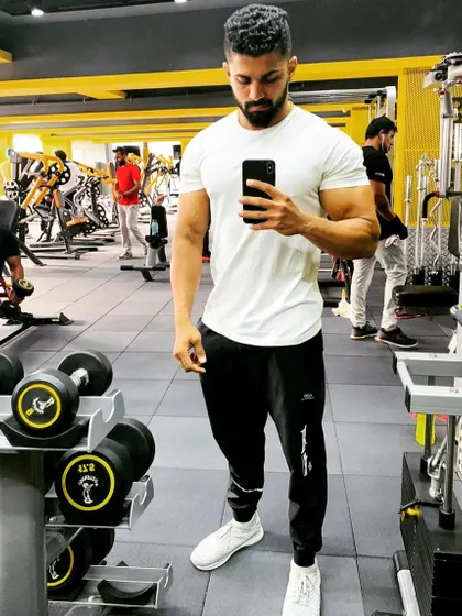 A casual selfie at Kitty's Muscle Planet. Even in a simple t-shirt, a well-built physique is noticeable, showing the importance of building a solid foundation of muscle.