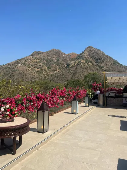 Decor elements that become part of the venue's existing setting is our favorite way to design a space, as seen with these lanterns and bougainvillea.