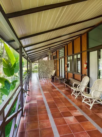 The long, shared balcony of our villaments at Kabini is a perfect spot to relax and enjoy the peaceful ambiance of the resort.