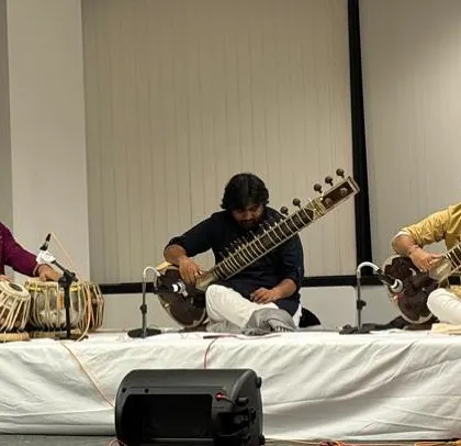 On stage in Chicago for a sitar duet concert. This setup, with two sitars and a tabla, allows for a rich interplay of melodies and rhythms, a core element of a classical jugalbandi.