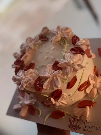 A cute mini cake with delicate piped flowers and petal details. It's a perfect example of my minimalist style.
