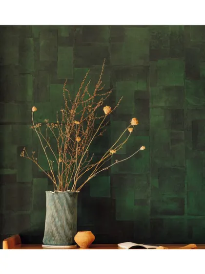 The 'Art Paper' collection is inspired by the beauty of artisanal paper. This deep green, textured wallpaper creates a rich, moody backdrop, perfect for showcasing art and decor.