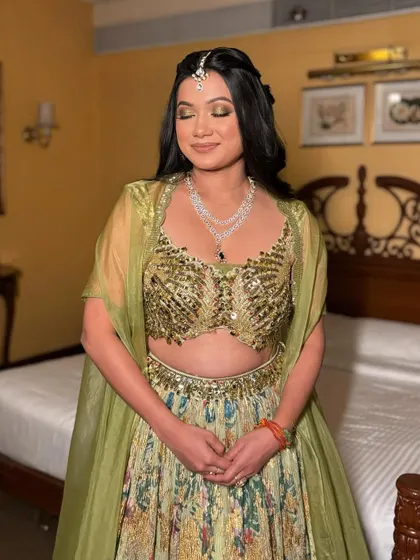 Rubina's full Mehendi look. The glowing skin and shimmery green eyes are a perfect match for her sequined green lehenga, creating a fun and festive vibe.