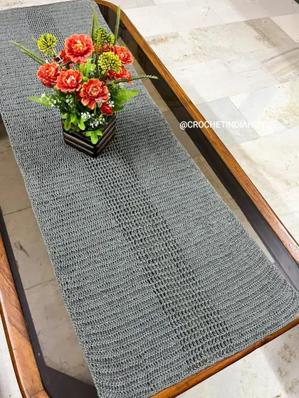Another angle of the crochet table runner, showing its clean lines and beautiful drape. It's a versatile piece that can be used for daily dining or special occasions.
