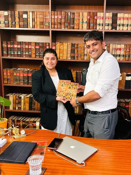 Receiving the book 'Unsung Warriors' from its author. It is always a pleasure to engage with and support fellow creators.