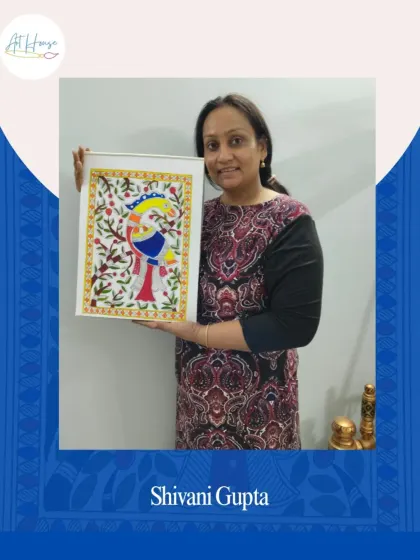 Student Shivani Gupta proudly holding her completed Madhubani painting. It's wonderful to see participants connect with this traditional art form from their own homes.
